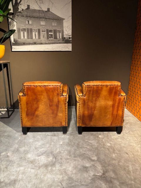 Set Vintage geleefde Schapenleren Art Deco fauteuils