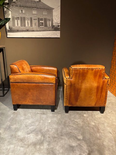 Set Vintage geleefde Schapenleren Art Deco fauteuils