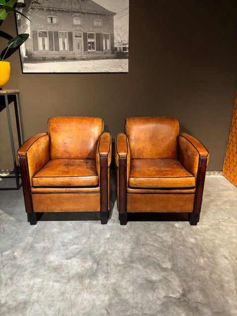 Set Vintage geleefde Schapenleren Art Deco fauteuils