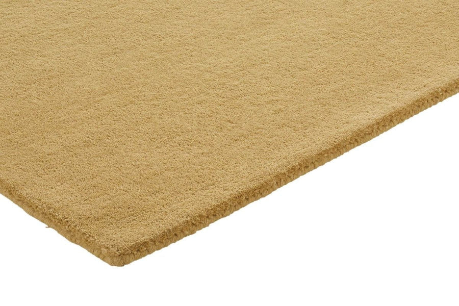 Brinker Organix wollen vloerkleed Gold in een interieur
