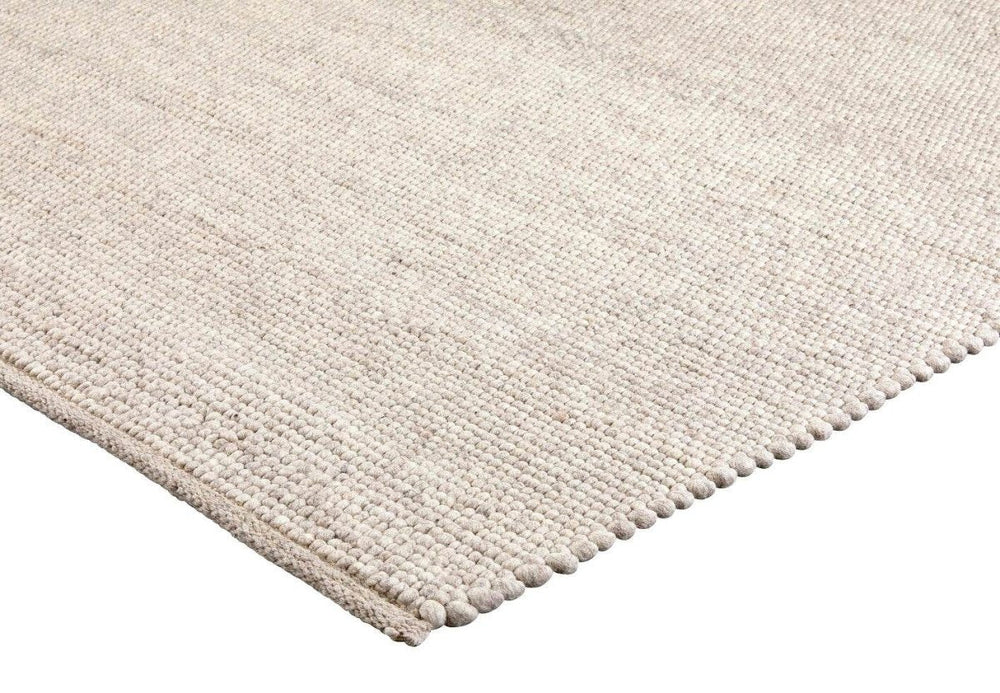 Brinker Valentino wollen vloerkleed Kiezel in een interieur
