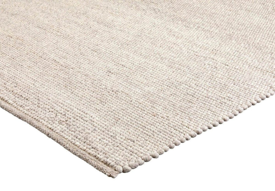 Brinker Valentino wollen vloerkleed Kiezel in een interieur