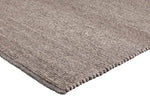 Brinker Valentino wollen vloerkleed Taupe in een interieur