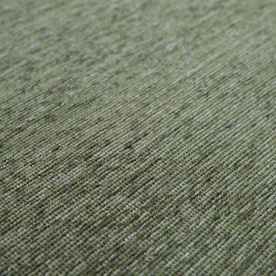 Close-up van de jacquard geweven structuur van het Maki vloerkleed