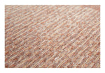 Close-up van de jacquard geweven structuur van het Nino vloerkleed Cookie