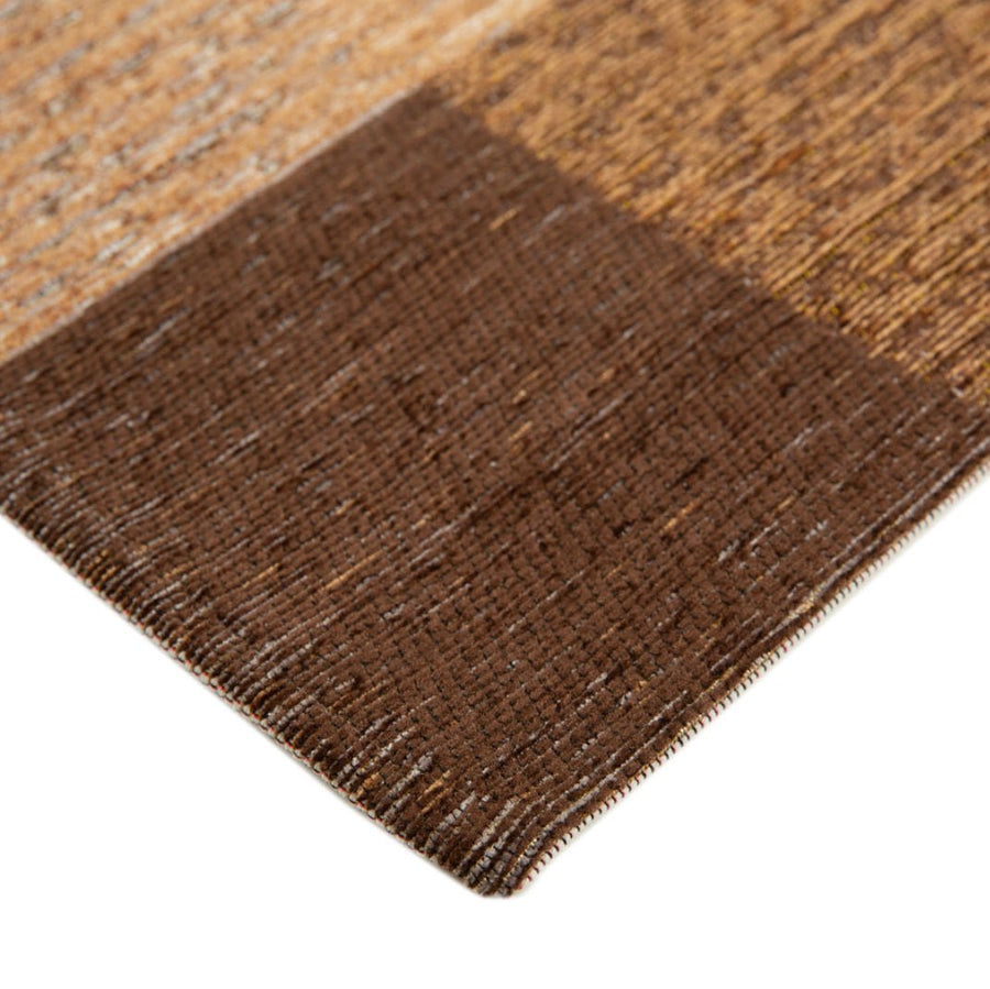 Hoekdetail van het Brinker Nino vloerkleed Natural met afgewerkte rand